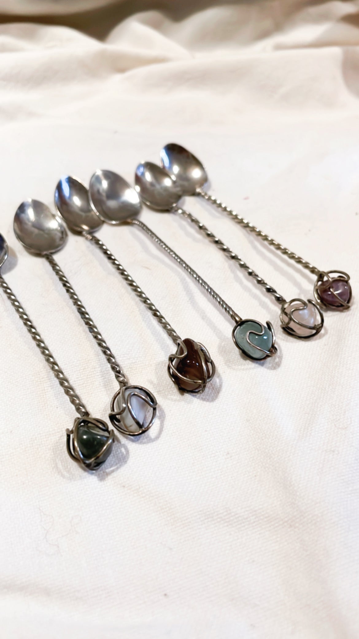 Antique silver spoons stones